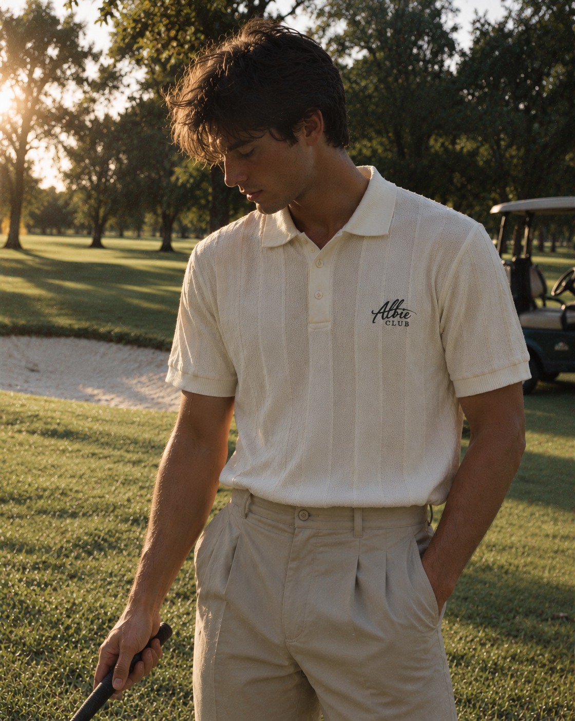 Ivory knit polo on the golf course
