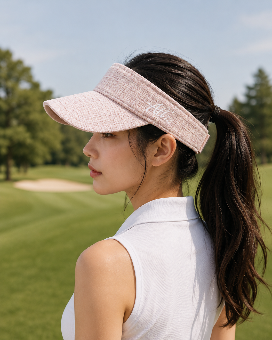 Pale pink visor worn on the golf course